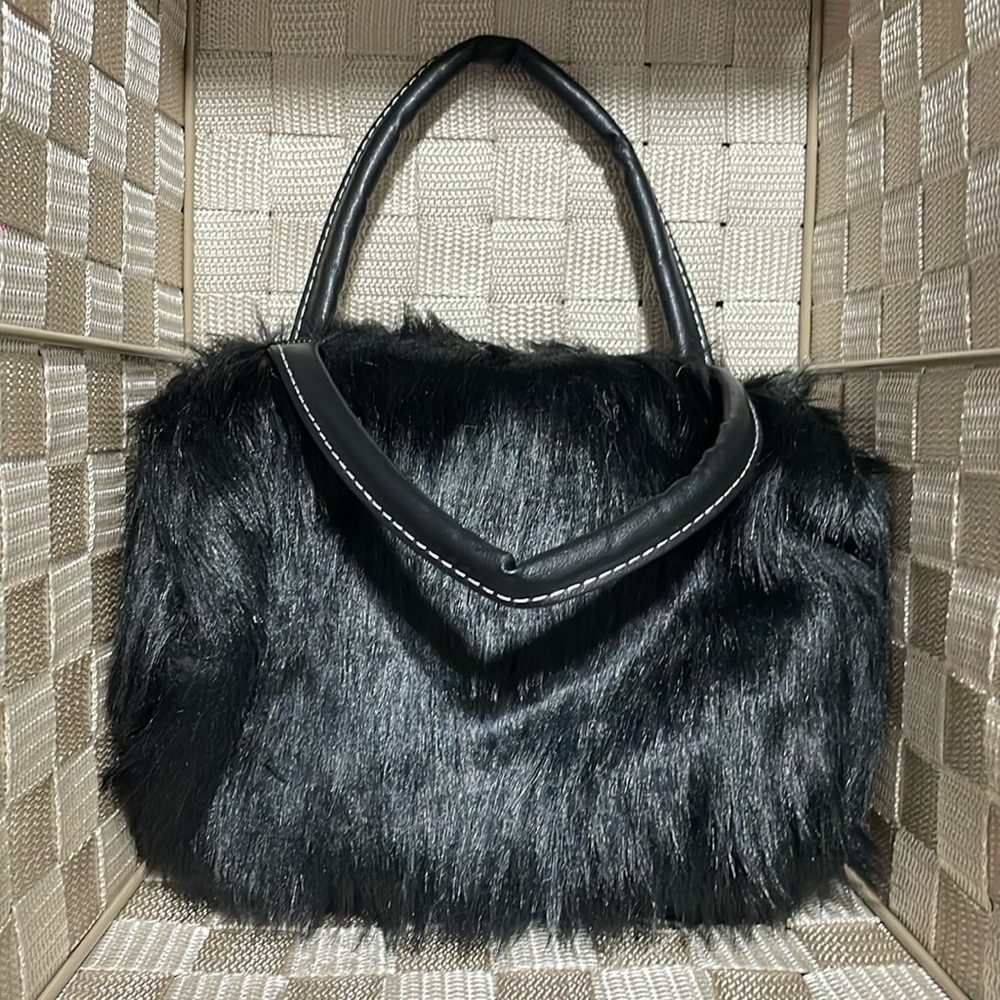 Fun, causal Black furry 7x9” purse. Includes shoulder strap. New, no tags.